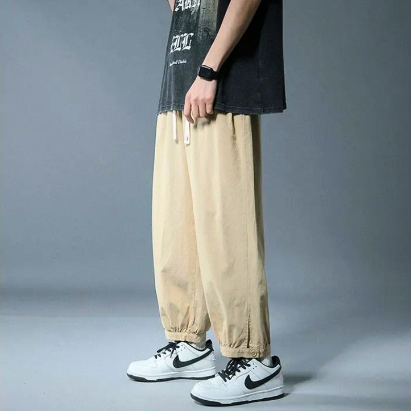 Casual bottoms: relaxed fit drawstring pants for men & women, ideal for comfortable daily wear.