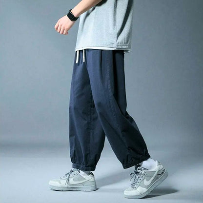 Comfortable casual drawstring pants, unisex design with a relaxed fit for ultimate everyday lounging.