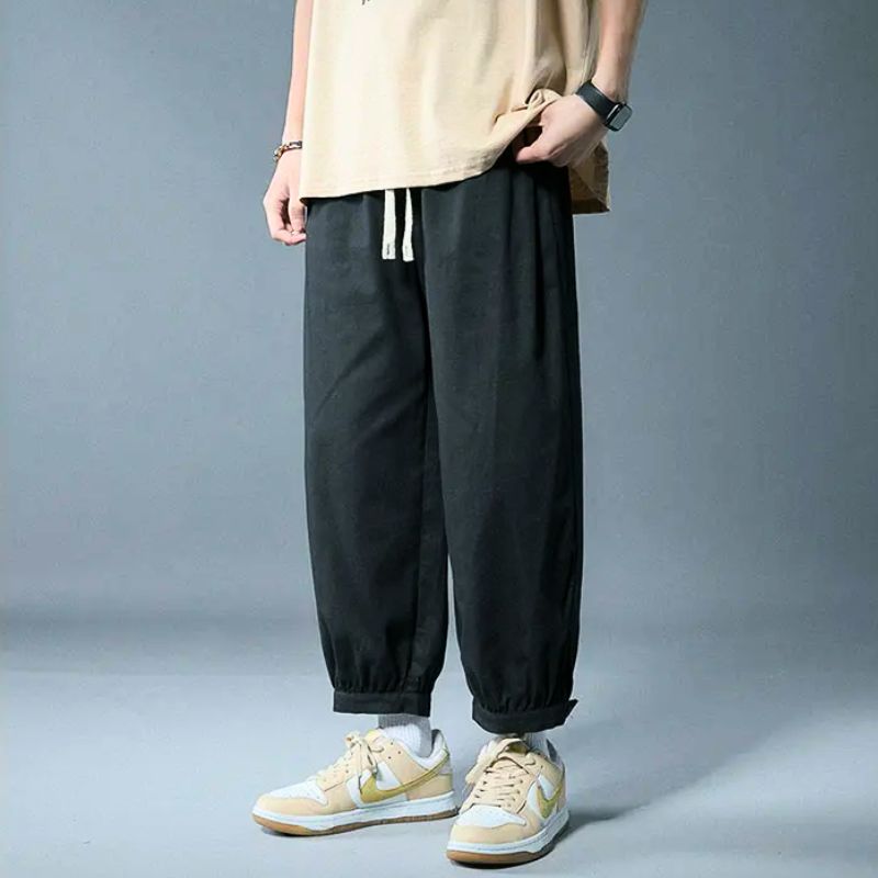 Soft, relaxed fit lounge pants with an adjustable drawstring waist and elastic cuff for unisex comfort.