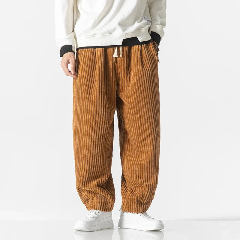 Vibrant orange yellow unisex relaxed fit pants, a comfortable and modern choice for casual style.