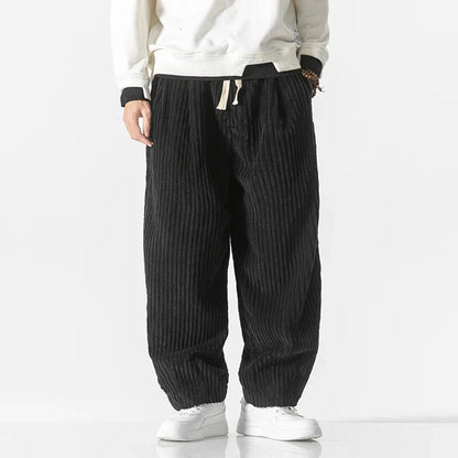 Black unisex relaxed fit pants, a sleek and comfortable option for stylish everyday wear.
