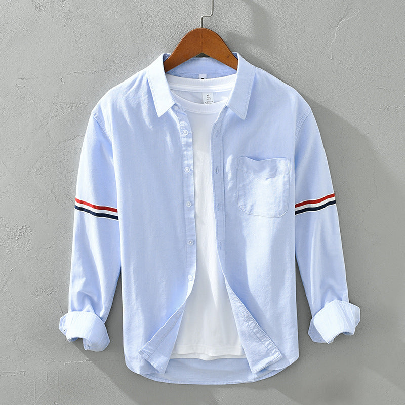 Versatile striped button-up shirt for men and women, relaxed fit, long sleeves, ideal for everyday casual.