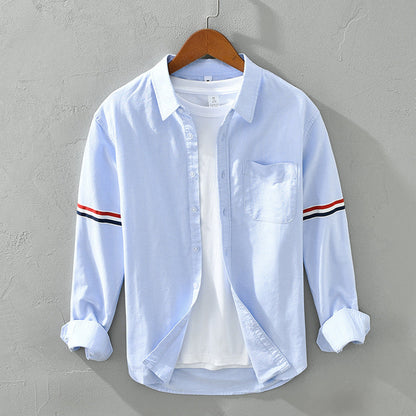 Versatile striped button-up shirt for men and women, relaxed fit, long sleeves, ideal for everyday casual.