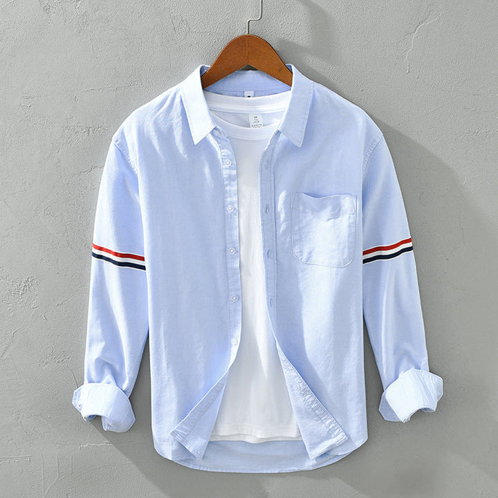Versatile striped button-up shirt for men and women, relaxed fit, long sleeves, ideal for everyday casual.