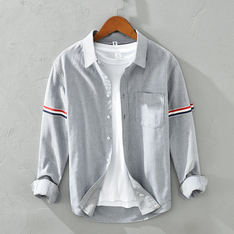 Casual unisex striped button-up shirt for everyday wear, ideal as a relaxed overshirt or smart-casual top.