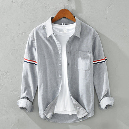 Casual unisex striped button-up shirt for everyday wear, ideal as a relaxed overshirt or smart-casual top.