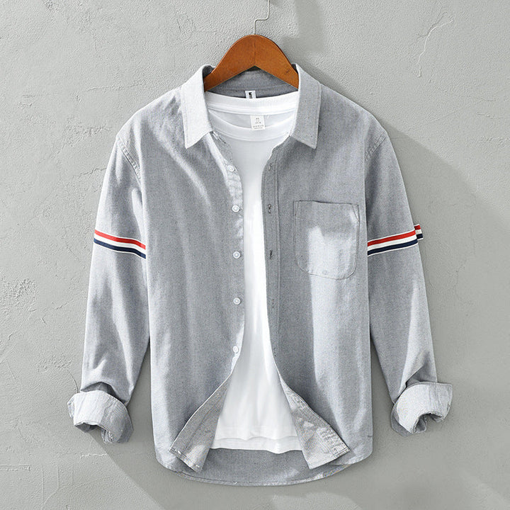 Casual unisex striped button-up shirt for everyday wear, ideal as a relaxed overshirt or smart-casual top.