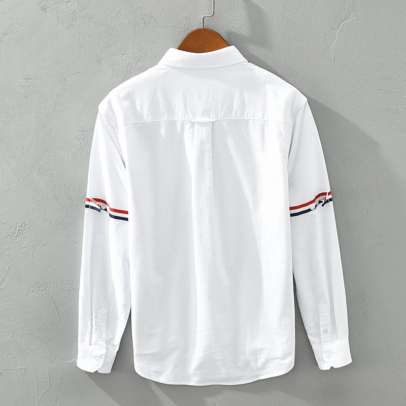 Stylish relaxed fit striped button-up shirt for men and women, offering comfortable casual spring/summer fashion.