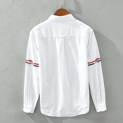 Stylish relaxed fit striped button-up shirt for men and women, offering comfortable casual spring/summer fashion.
