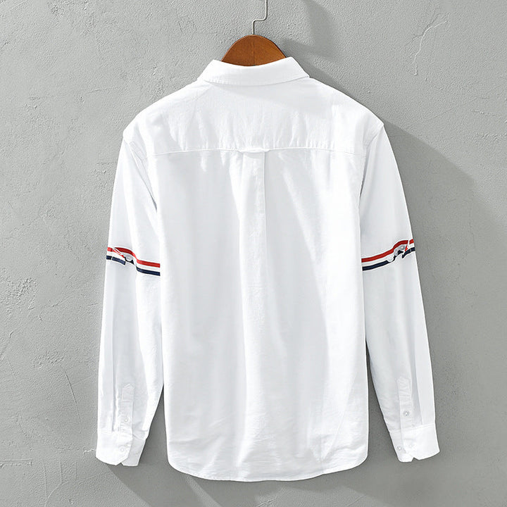 Stylish relaxed fit striped button-up shirt for men and women, offering comfortable casual spring/summer fashion.