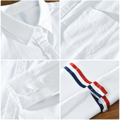 Classic striped unisex button-up shirt with a relaxed silhouette, suitable for versatile casual outfits.