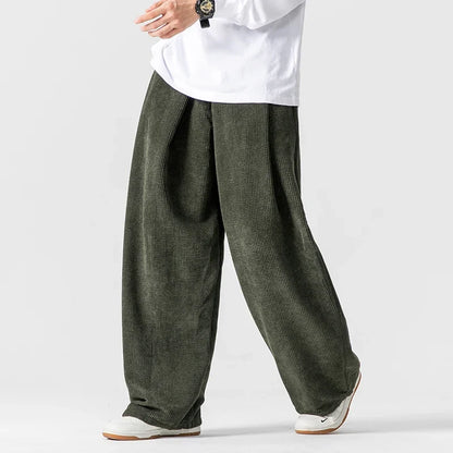 Unisex relaxed fit wide-leg pants with drawstring, perfect for casual everyday wear.