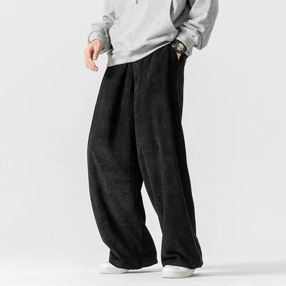 Versatile unisex wide-leg pants featuring a comfy drawstring waist for casual & everyday streetwear style.
