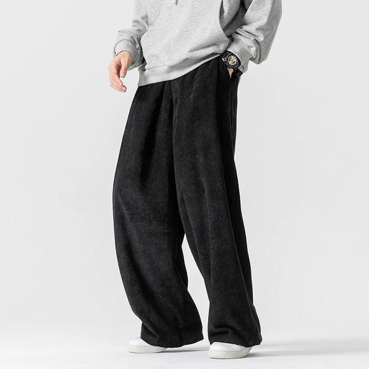 Versatile unisex wide-leg pants featuring a comfy drawstring waist for casual & everyday streetwear style.