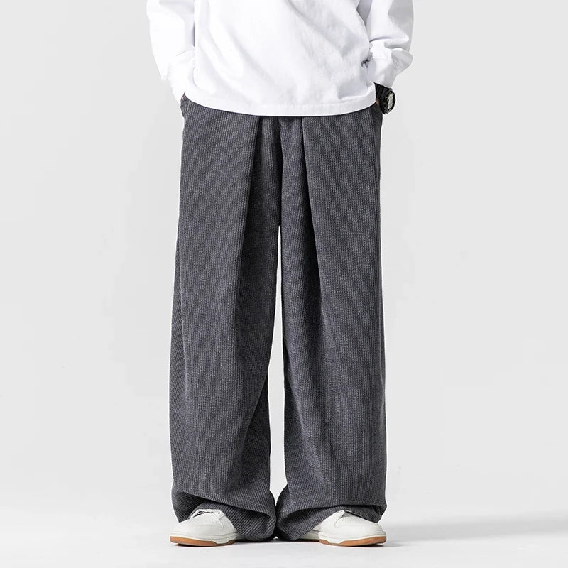 Unisex wide-leg pants with drawstring, a relaxed fit essential for comfortable, everyday casual fashion.