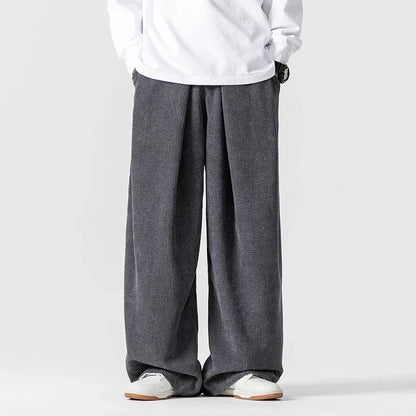 Unisex wide-leg pants with drawstring, a relaxed fit essential for comfortable, everyday casual fashion.
