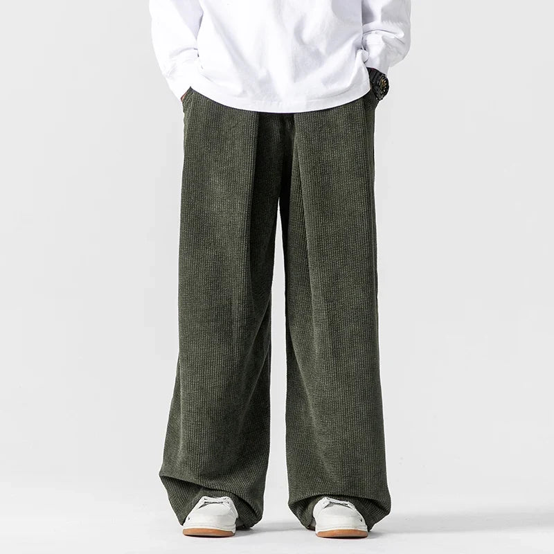 Walk in comfort with these relaxed fit unisex wide-leg drawstring pants, ideal for casual everyday wear.