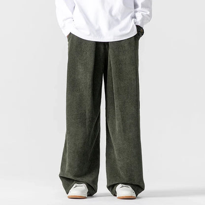 Walk in comfort with these relaxed fit unisex wide-leg drawstring pants, ideal for casual everyday wear.