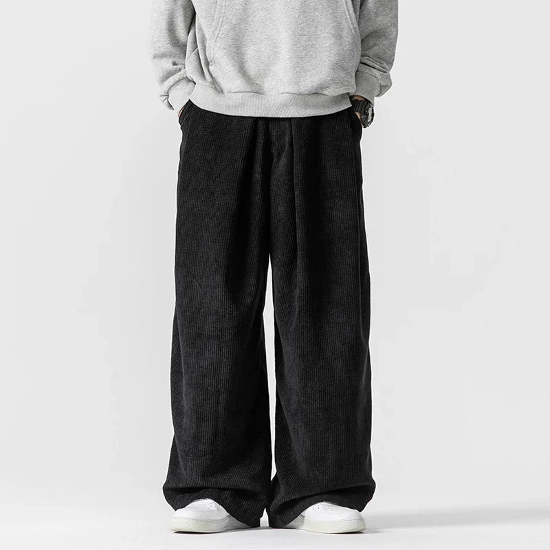 Modern take on 90s vintage wide-leg pants with a relaxed unisex fit & adjustable drawstring for comfort.