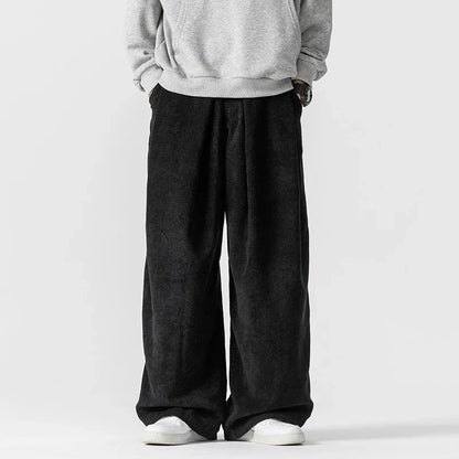 Modern take on 90s vintage wide-leg pants with a relaxed unisex fit & adjustable drawstring for comfort.