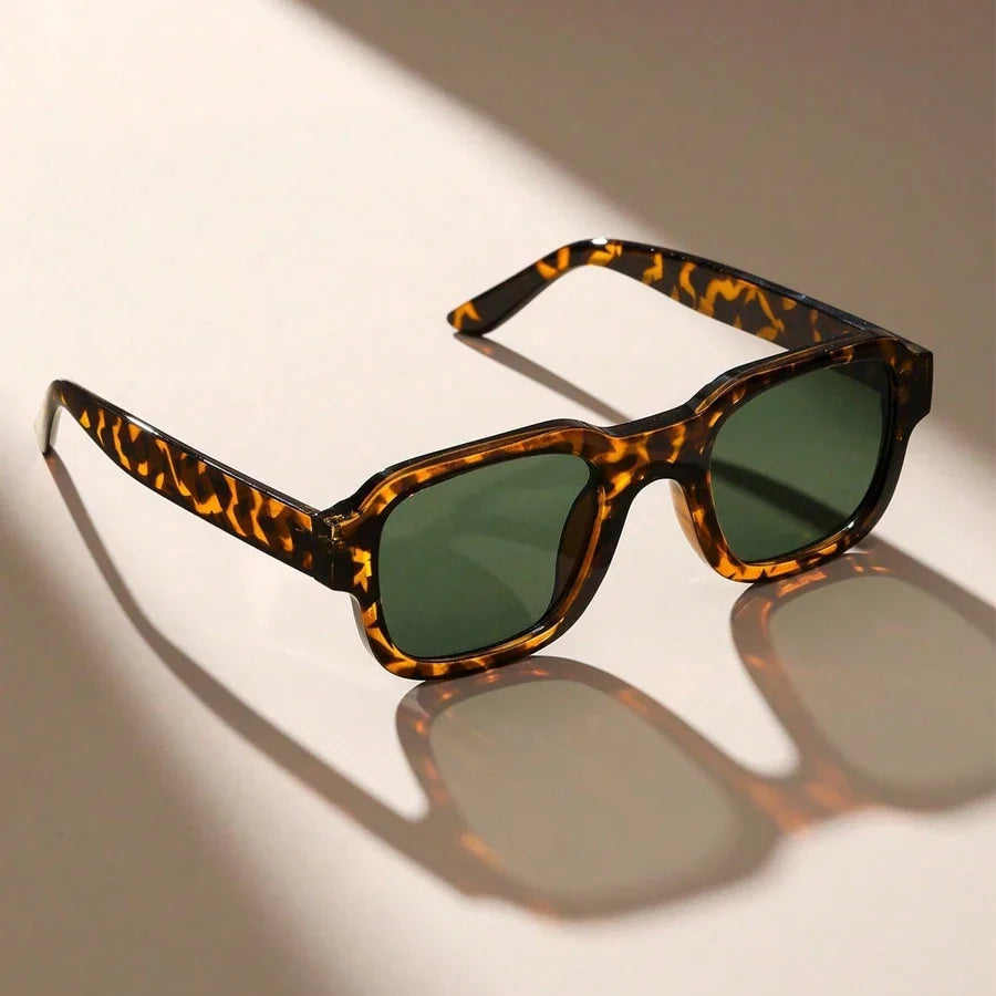 Stylish black retro bold frame sunglasses offering UV protection for everyday wear. Unisex fashion accessory.