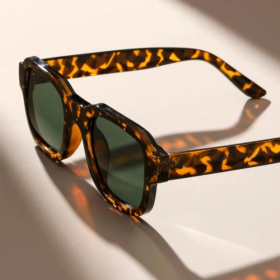Chic leopard print retro bold frame sunglasses, unisex fashion accessory for summer and UV protection.