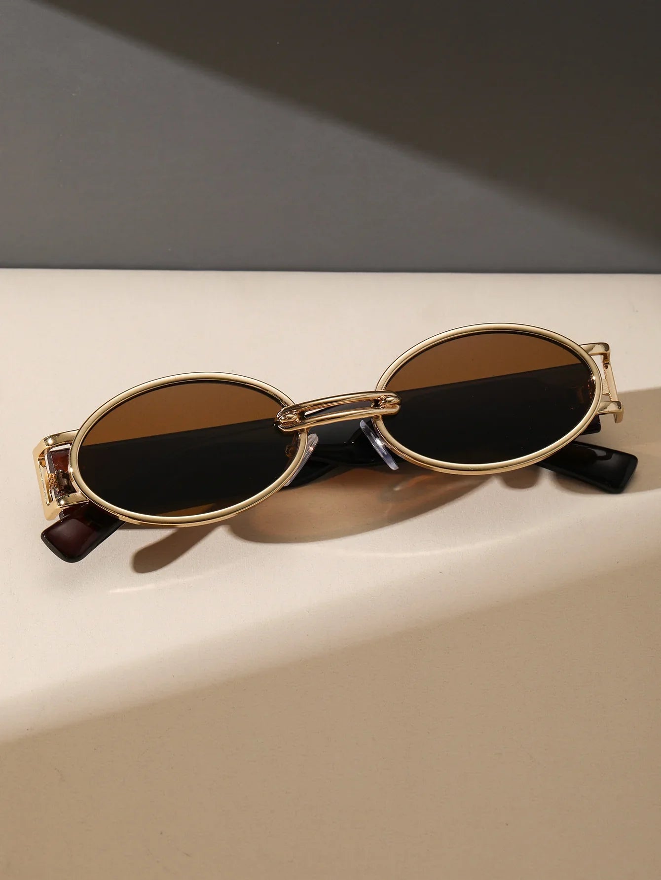 Unisex fashion accessories: retro sunglasses with integrated UV protection.
