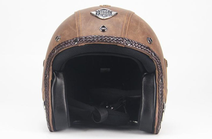 Vintage brown open face motorcycle helmet, providing classic style and essential head protection for riders.