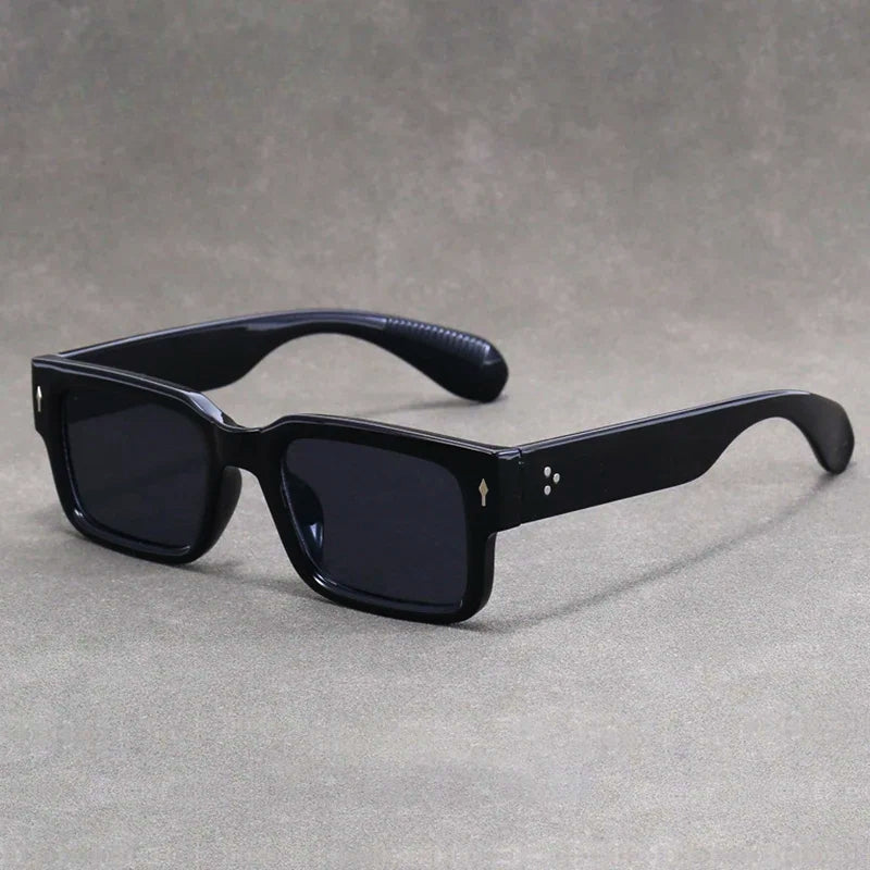 Classic retro rectangular sunglasses, a stylish unisex accessory providing essential eye protection & vintage flair.
