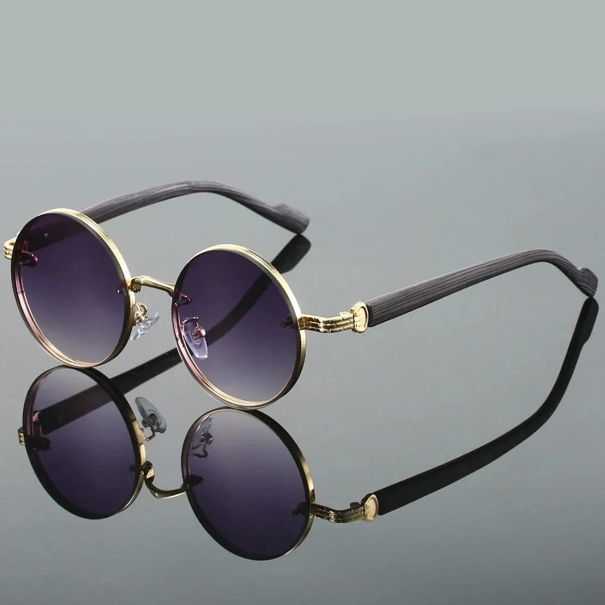 Fashionable retro round frames with unique gradient lenses. Unisex shades offering essential UV protection eyewear.