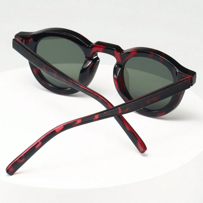 Fashionable unisex round sunglasses, classic retro style with UV protection.