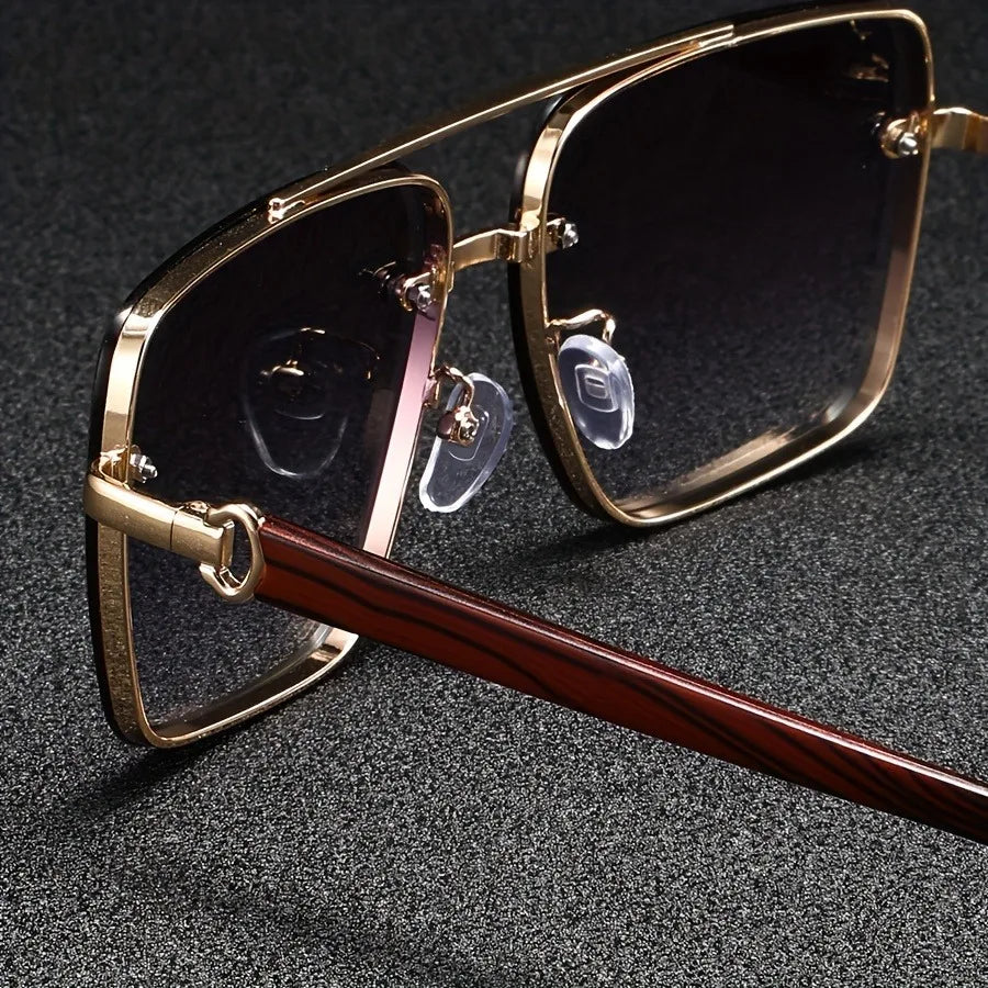 Close-up of retro square sunglasses featuring gradient lenses & robust UV protection. Fashionable unisex shades.