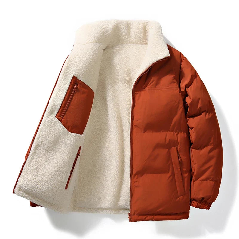 Woman wearing a warm unisex reversible winter jacket. Aspen style, perfect for snowy days.