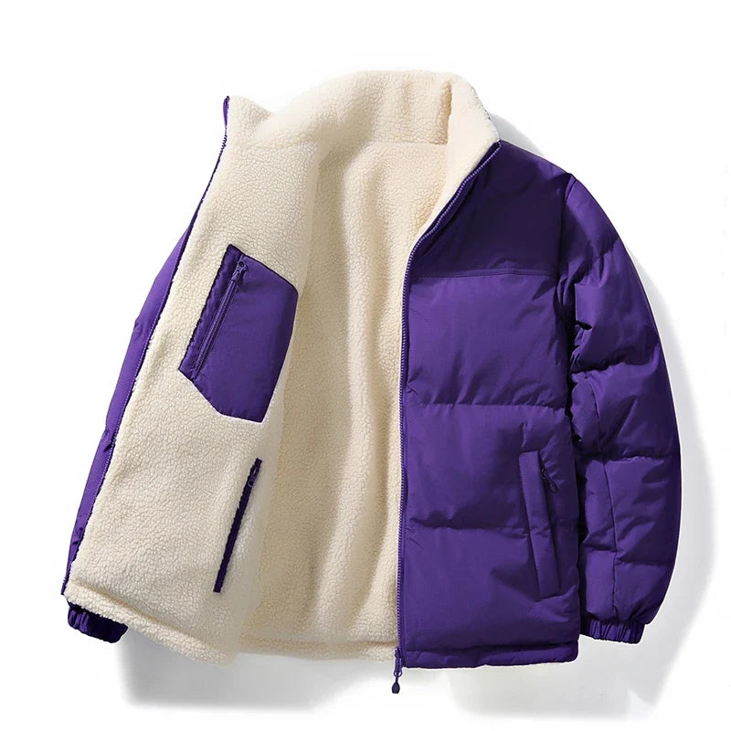 Close-up of durable zipper on unisex reversible winter jacket, showing quality utility outerwear.