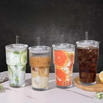 Close-up of ribbed texture on a clear glass travel tumbler. Unisex, spill-proof, and portable drinkware.