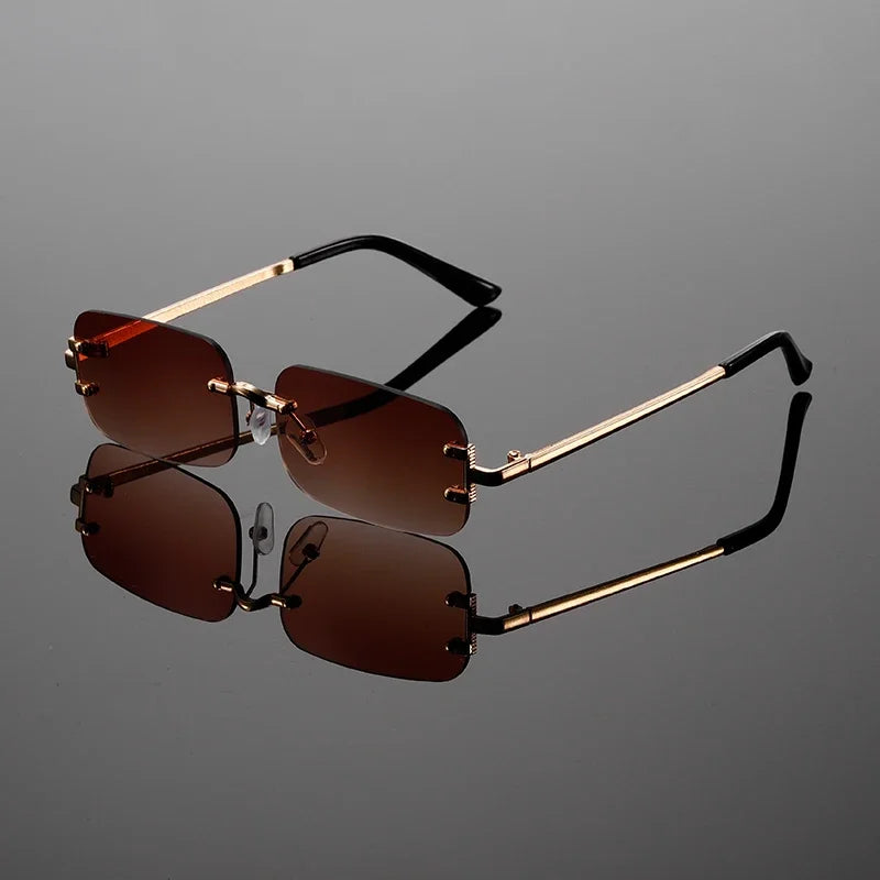 Stylish unisex rimless rectangular shades. Modern metal frame eyewear for sleek fashion and sun protection.