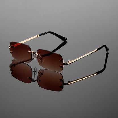 Stylish unisex rimless rectangular shades. Modern metal frame eyewear for sleek fashion and sun protection.