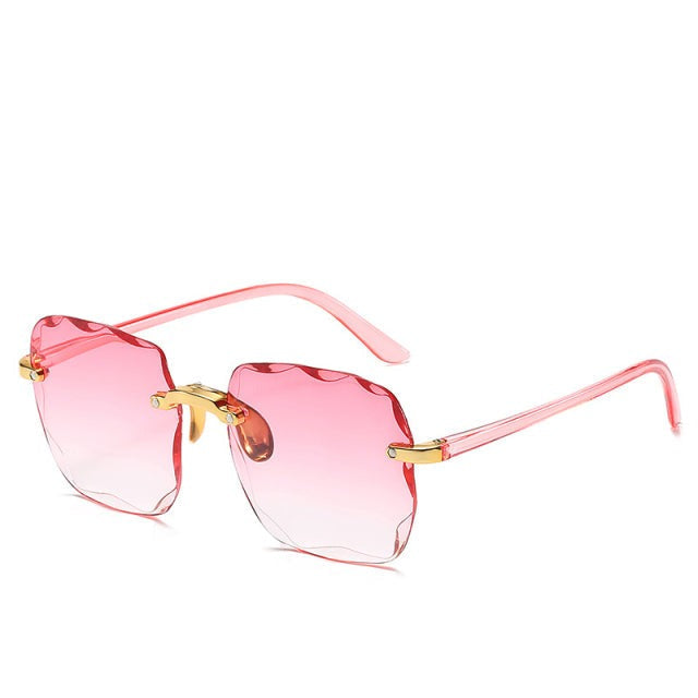 Chic rimless vintage sunglasses for a trendy look. Unisex design with UV400 eye protection, a must-have fashion accessory.