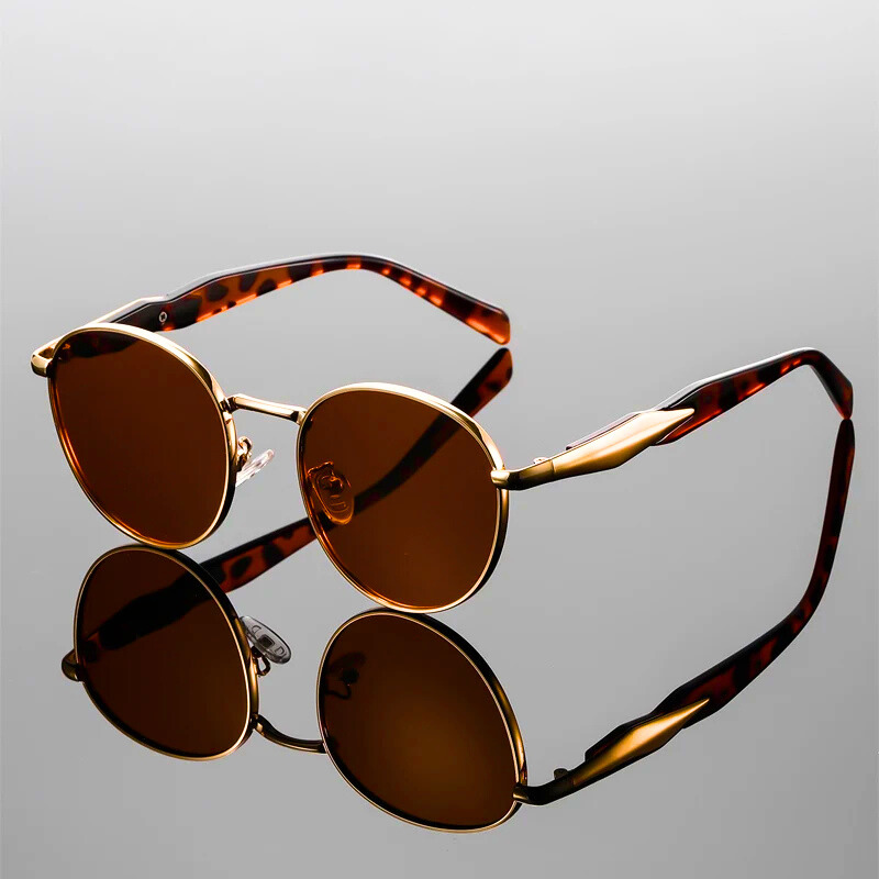 Stylish metallic rounded sunglasses, offering essential UV400 protection for a trendy look.