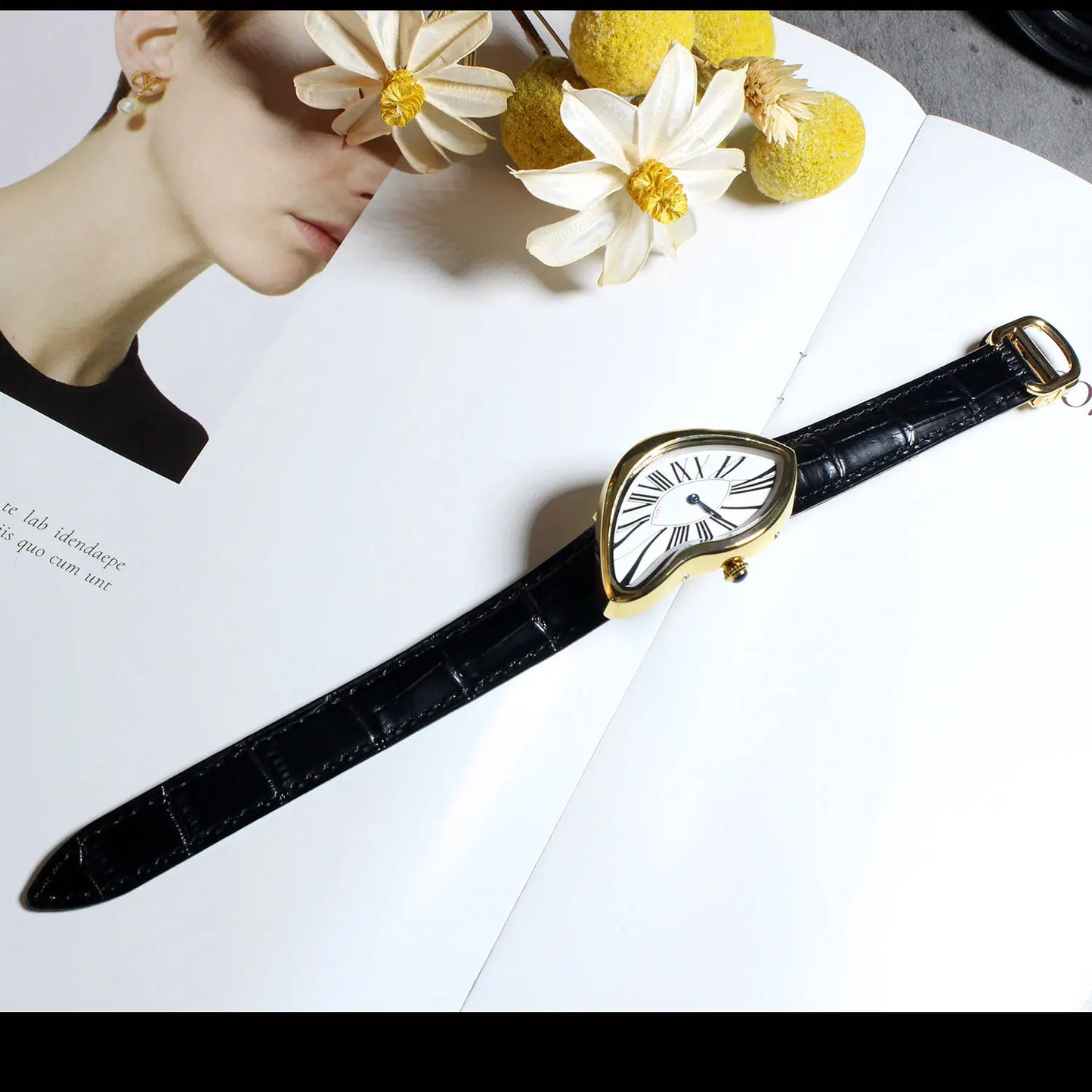 Unique sculptural asymmetric watch, a distinctive fashion accessory with a comfortable leather strap and elegant look.