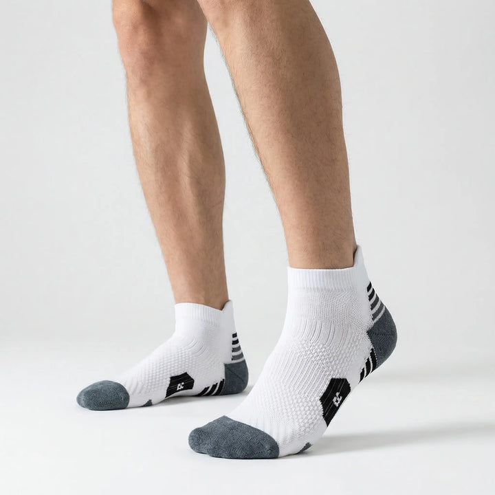 High-performance unisex short ankle socks for athletes. Cushioned sports training socks with non-slip grip for running & gym.
