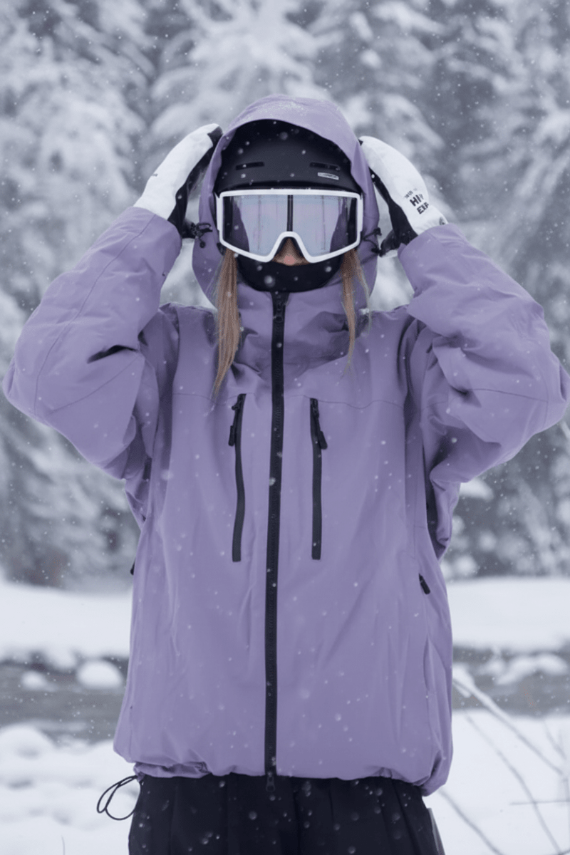 Warm unisex winter sports jacket for skiing & snowboarding. Weatherproof shell with adjustable hood for comfort.