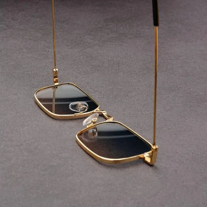 Sleek rectangular sunglasses with a bold metal frame, delivering a contemporary and stylish eyewear statement.