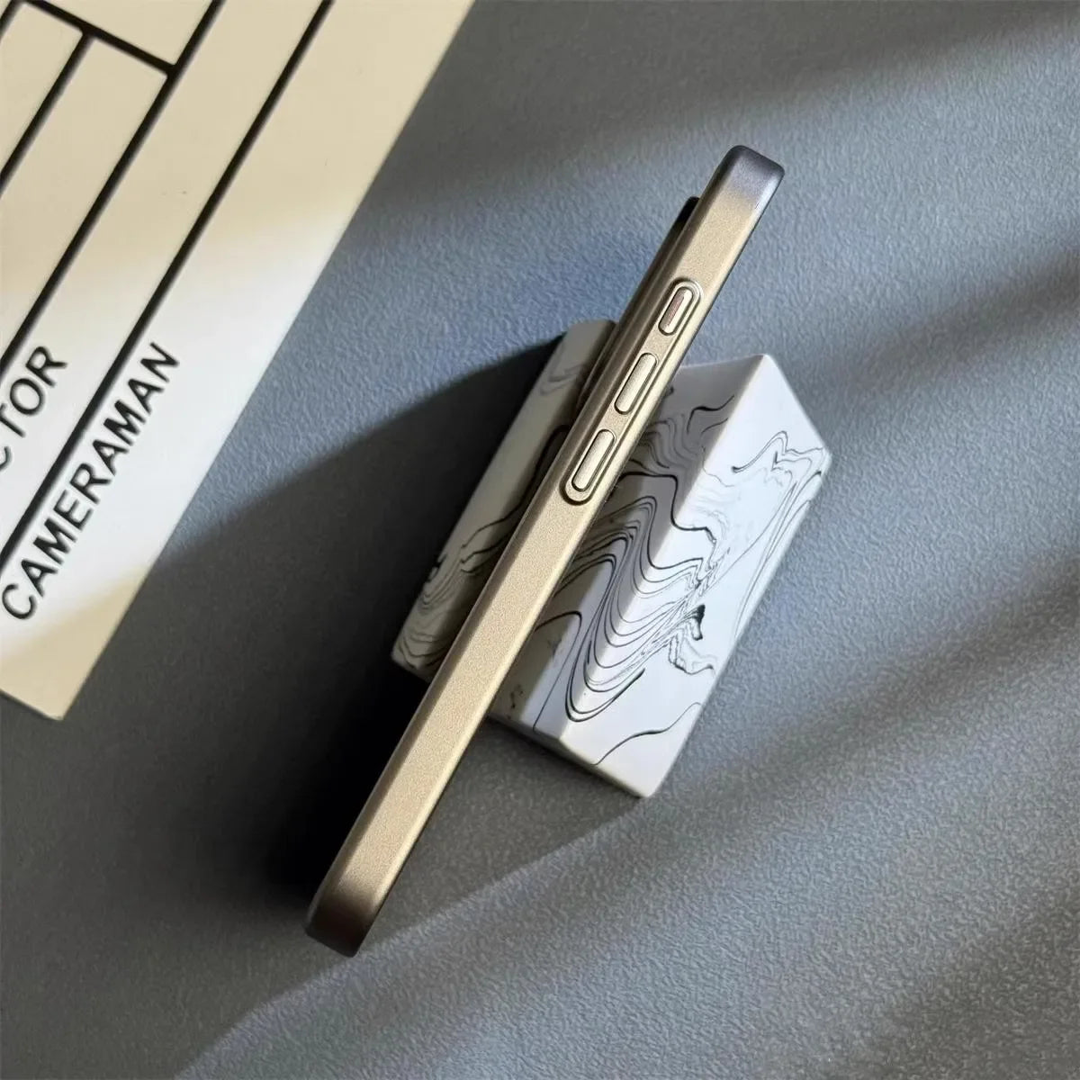 Lightweight titanium iPhone case, minimalist design. Protects your phone from drops & scratches.