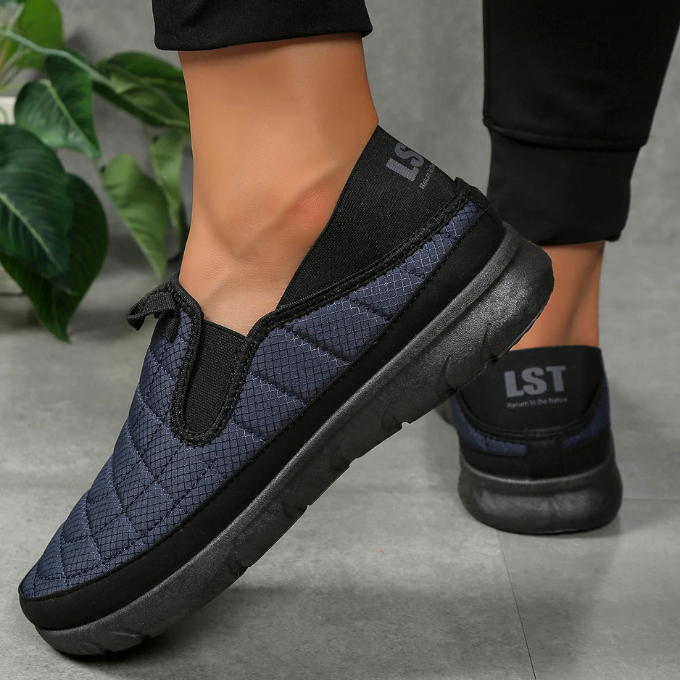 Comfortable slip-on walking shoes with a quilted, water-resistant, and breathable design.