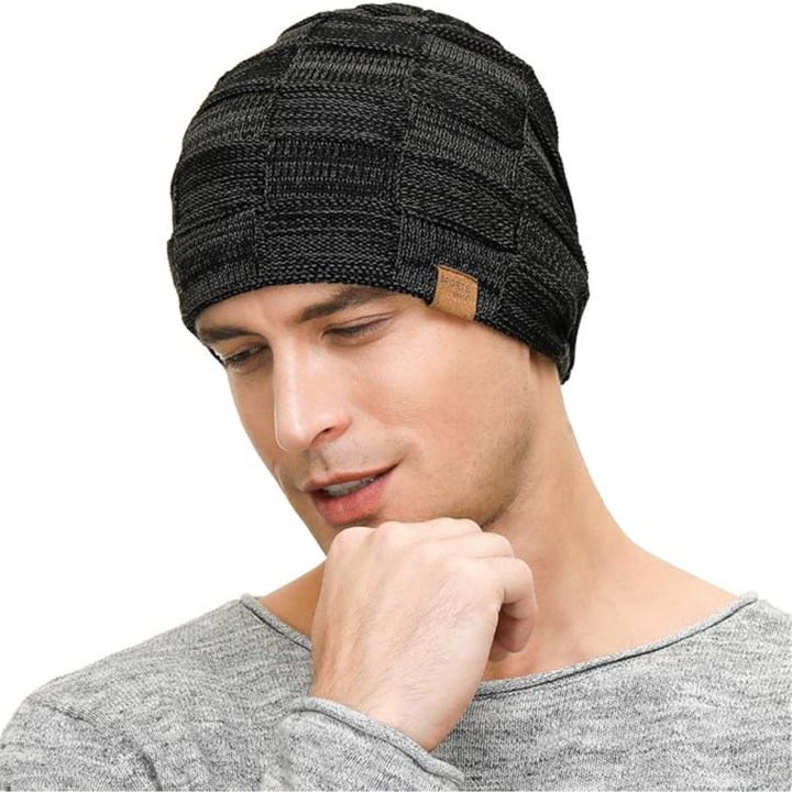 Stylish headwear: a soft knitted slouchy beanie, offering unisex warmth and a chic accessory for winter.
