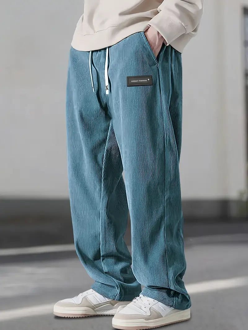 Back view of relaxed fit soft corduroy wide leg pants, a unisex staple for autumn.