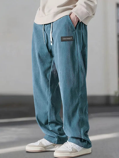 Back view of relaxed fit soft corduroy wide leg pants, a unisex staple for autumn.