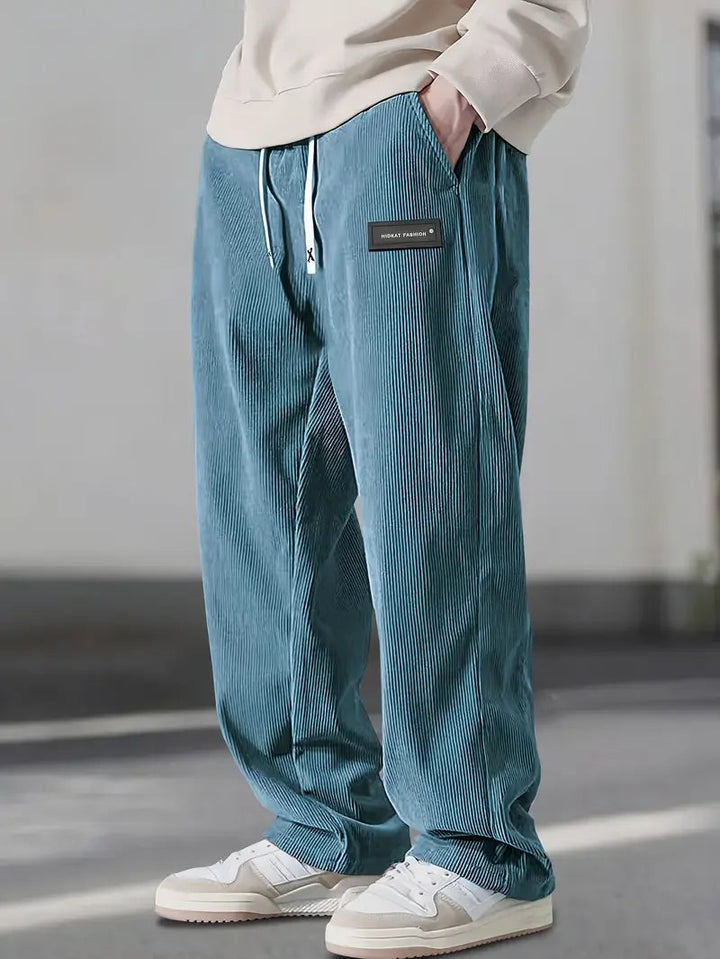Back view of relaxed fit soft corduroy wide leg pants, a unisex staple for autumn.