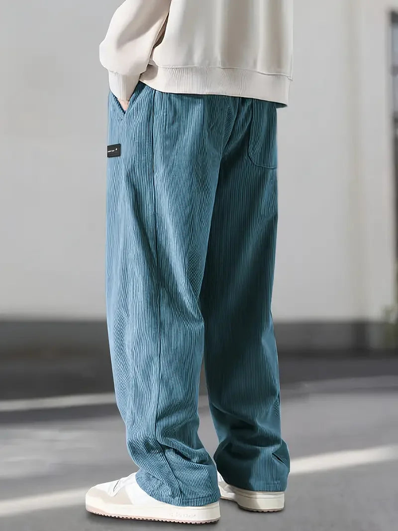 Close-up of the soft corduroy fabric on unisex wide leg pants, highlighting texture & quality.